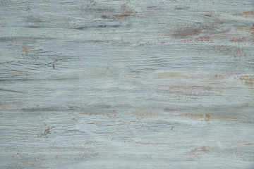 Light grey-blue wooden texture with crackled paint. Aged wood surface, copy-space