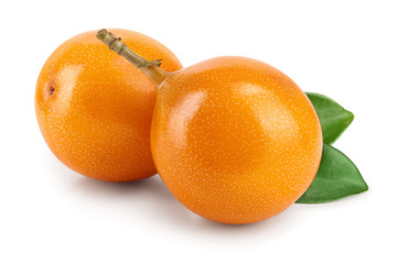 Granadilla or yellow passion fruit with leaves isolated on white background