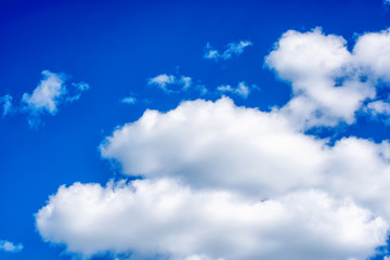 Fluffy white clouds on background of blue sky wallpaper