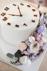 The newlyweds, the bride and groom, cut the wedding cake at the banquet.