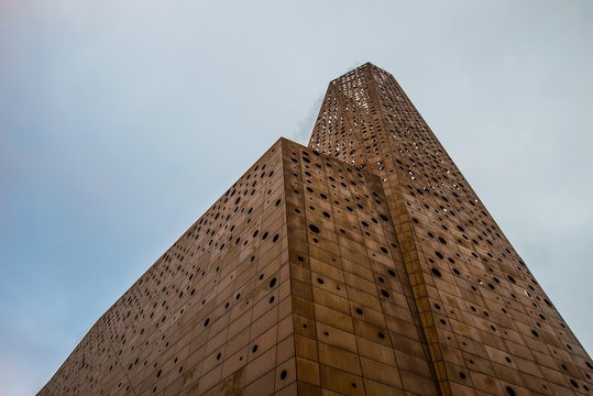 trash-to-energy plant and its chimney rises to the heaven like the tower of a cathedral