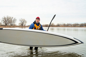 senior man with stand up paddleboard