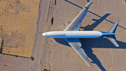 Aerial drone top view photo of abandoned passenger air plane in old airport no longer used