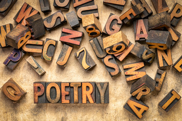 poetry word abstract in wood type - obrazy, fototapety, plakaty
