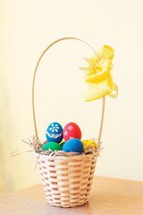 Easter basket filled with hand painted pastel Easter Eggs