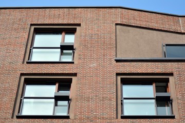Fragment of a modern apartment building in front. Very modern apartment house.