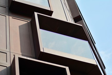 Obraz premium Fragment of a modern apartment building in front. Very modern apartment house.