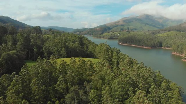 Aerial view beautiful nature with mountains and hills by Lake Mattupetty. Kerala State. Near the city of Munar.
