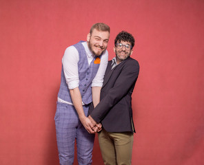 gay men acting silly, hugging together.