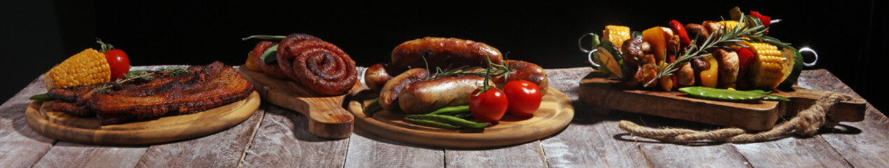 Assorted delicious grilled meat and skewer with vegetable on rustic table