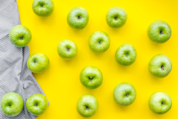 summer food with apples on yellow background top view pattern