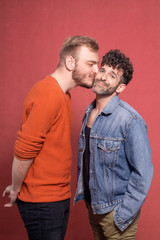 two men, gay couple intimate. kiss on cheek.