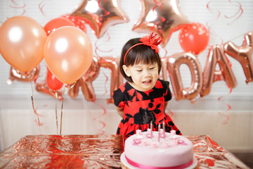 toddler girl celebrating her third birthday at home