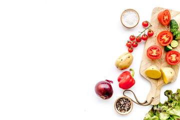 Fresh food ingredients for vegetarian kitchen on white background top view mock-up