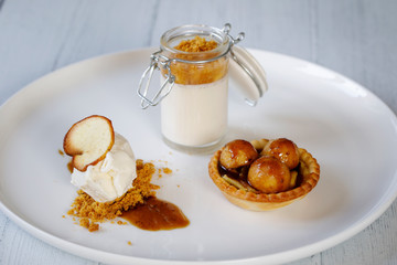 Trio of desserts, panna cotta, ice cream and apple tart