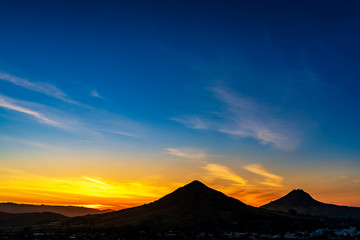 Fototapeta na wymiar Sunset in Silhouetted Mountains