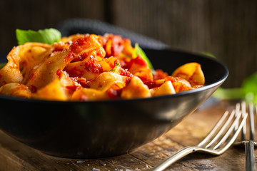 Tasty italian pizza with tomato sauce and parmesan