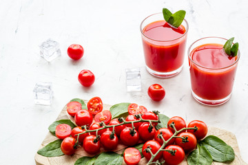summer cocktails for freshness with red tomato and ice on white background