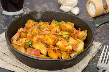 Tyrolean fried potatoes with bacon and onion in a pan. Tyrolean potato specialty