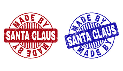 Grunge MADE BY SANTA CLAUS round stamp seals isolated on a white background. Round seals with grunge texture in red and blue colors.