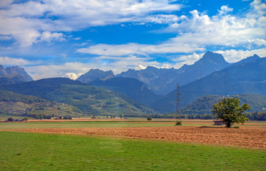 Fototapeta na wymiar landscape with green fields and mountains