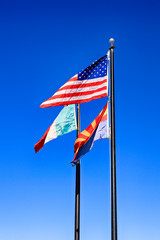 Mexican, American and Arizona state Flags at the Border between the two countries