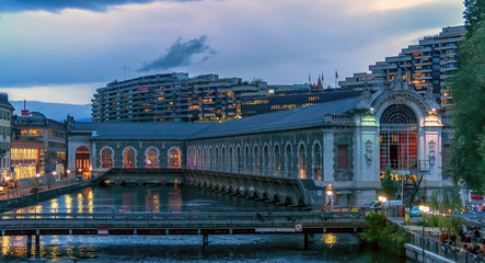city building on a river at twilight