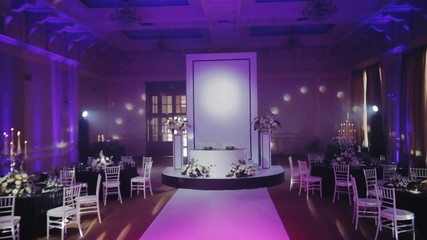 White table for the newlyweds. Luxury banquet hall decorated in black and white tones