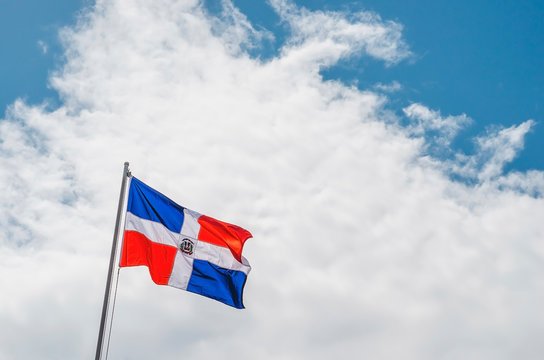 image of the Dominican Republic flag with blue sky