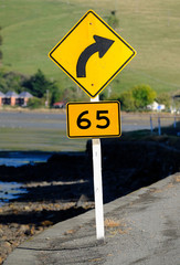 New Zealand road sign, bend in road