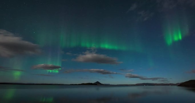 Timelapse of northern lights with beautiful landscape in view