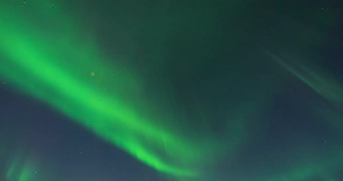 Timelapse of northern lights with beautiful landscape in view