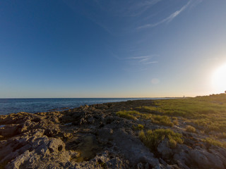 Fototapeta na wymiar Sunset over the beach of the Riviera Maya in Tulum, Quintana Roo, Mexico