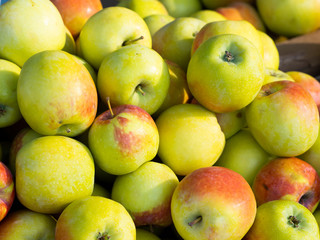 Lots of fresh green red apples.