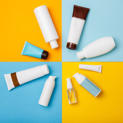 summer skin care cosmetics on yellow and blue background. White bottles of woman cosmetics on yellow. Summer holidays or vacation. Preparation for summer care. Sunscreen protection  products. Sun form