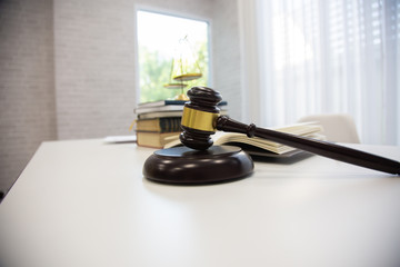 Lawyer desks consist of hammers and scales in the law office.concept of law