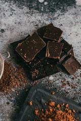black chocolate and cocoa powder lie beautifully on the table