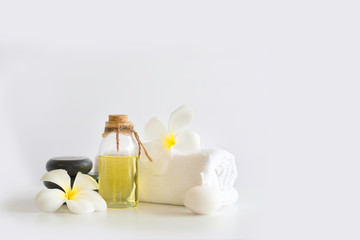 Oil aroma from flower, Beautiful Stones spa composition on white background.