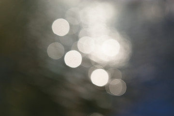 Abstract background Bokeh for the celebration of the holiday season, Mix of white with gray and black color circle on blue