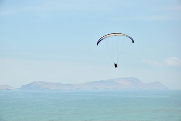 Paraglider above the sea