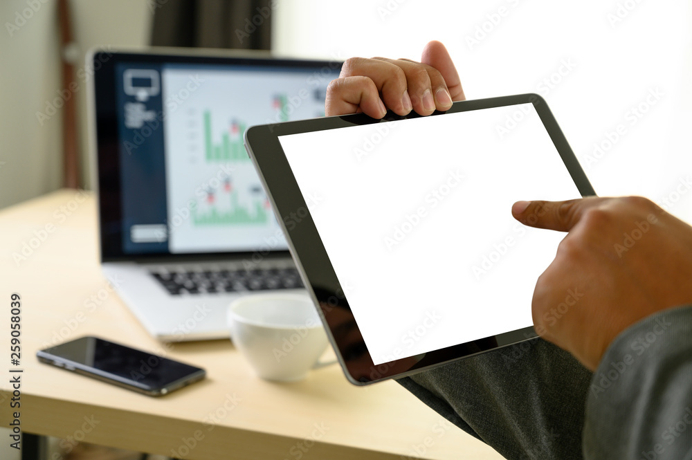 Poster man hands multitasking man using tablet close up close up working in office