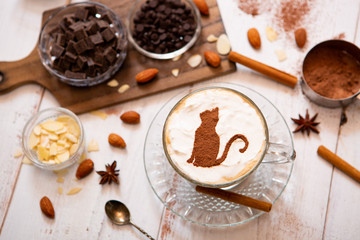 cat mark decorated on cup of hot chocolate