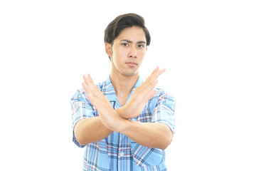 禁止の意思表示をする男性