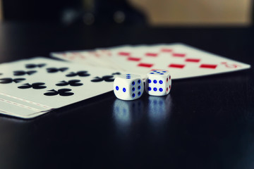 dice with cards on the table