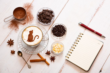 cat mark decorated on cup of hot chocolate