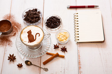 cat mark decorated on cup of hot chocolate