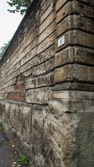 Fototapeta premium old rotten wall around park
