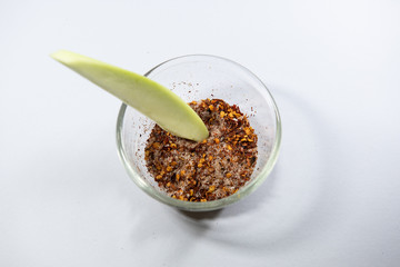 Thailand snack traditional ,Raw mango with salt and chile pepper sauce on white plate.