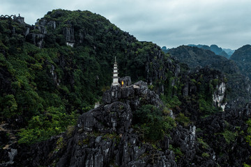 Aerial drone photo - A woman atop a shrine in the mountains of northern Vietnam