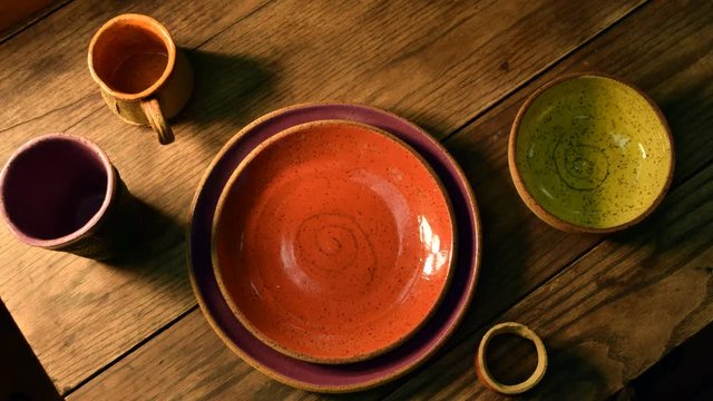 The camera pans over a table setting from directly above in this flatlay